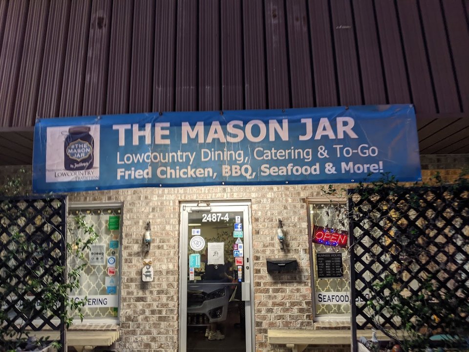 Casual seafood restaurant dining room with simple tables.