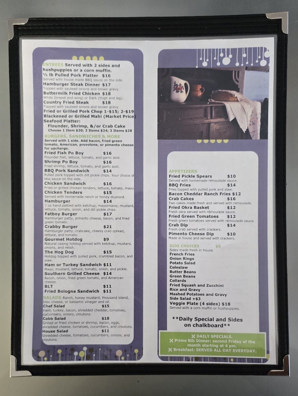 Menu board with seafood platters and sandwiches.